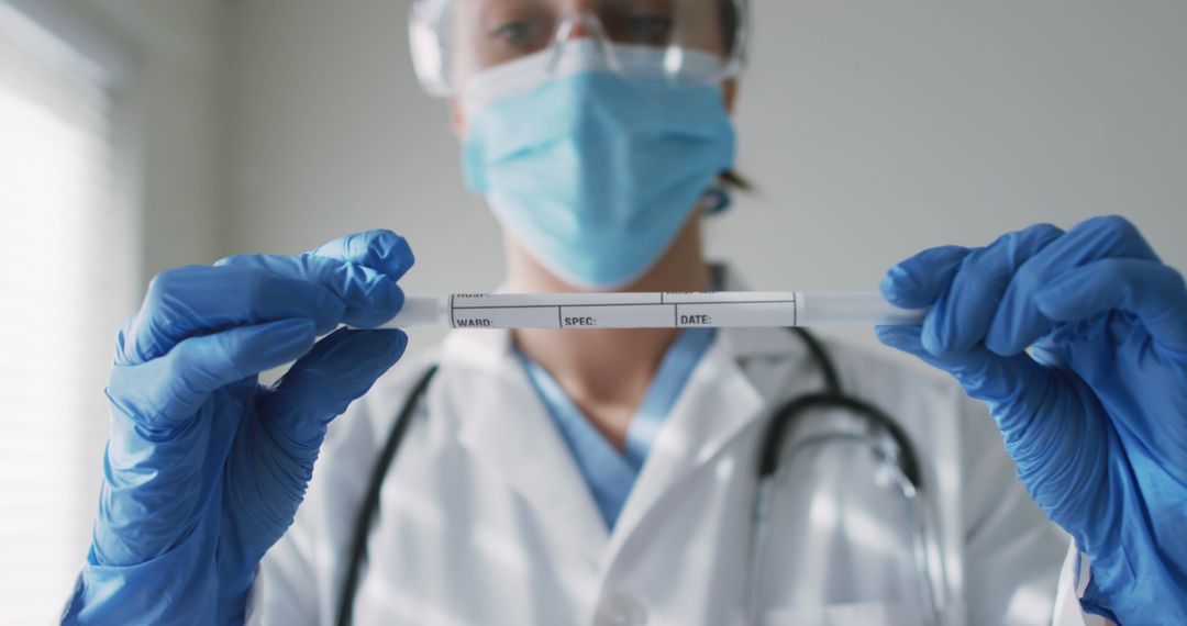 Healthcare Professional Holding DNA Sample Vial in Laboratory - Free Images, Stock Photos and Pictures on Pikwizard.com