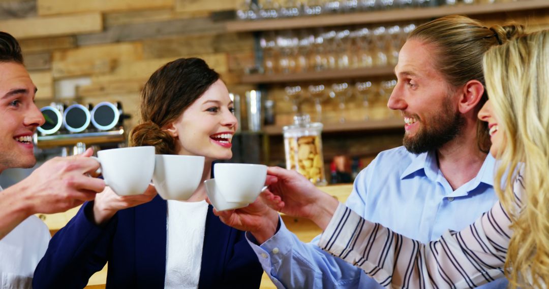 Group of Friends Toasting in Cozy Cafe