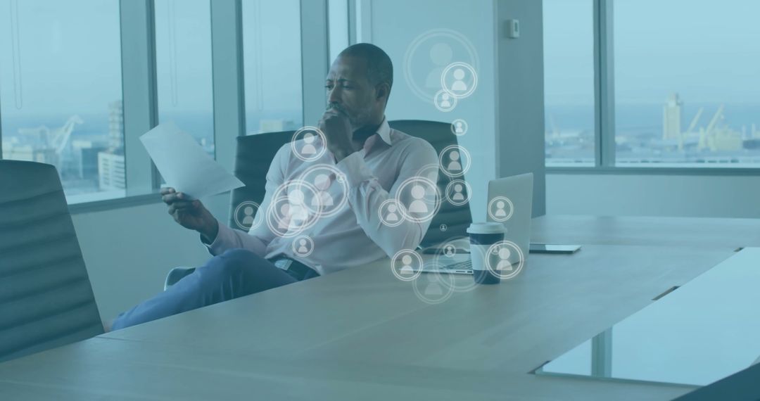 Businessman Analyzing Document with Digital Networking Icons in Office