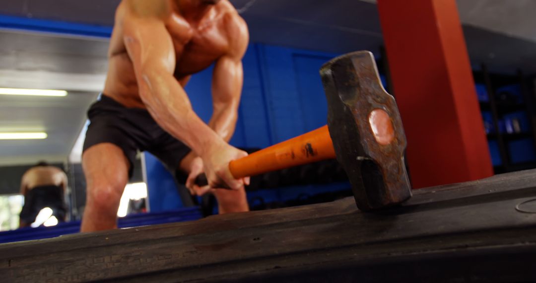 Fit Muscular Man Exercising with Sledgehammer at Gym - Free Images, Stock Photos and Pictures on Pikwizard.com