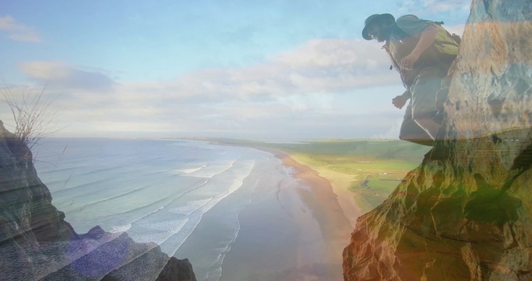 Backpacker on Dramatic Cliff Overlooking Scenic Coastline