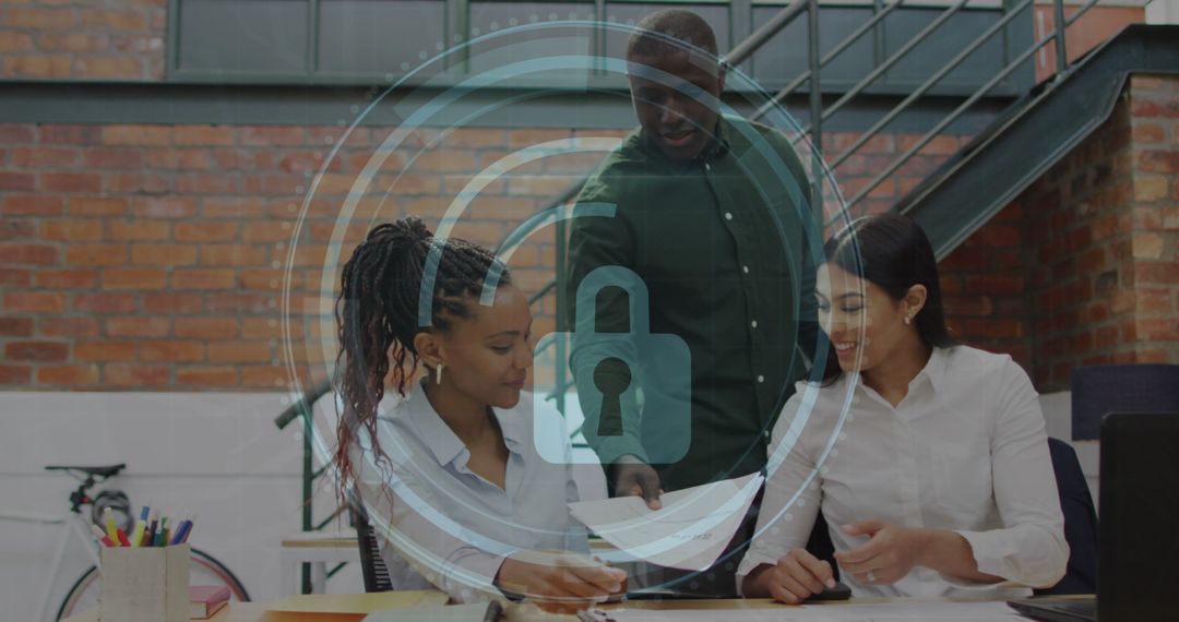 Diverse Team Discussing Cybersecurity Concepts in Modern Office
