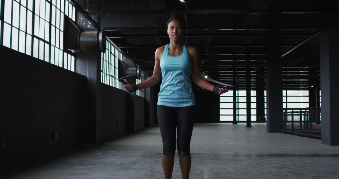 Woman Jumping Rope in Industrial Style Gym - Free Images, Stock Photos and Pictures on Pikwizard.com