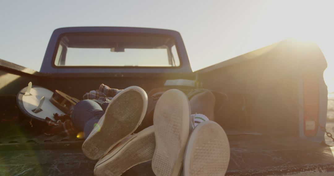 Young Couple Relaxing in Truck Bed at Sunset - Free Images, Stock Photos and Pictures on Pikwizard.com