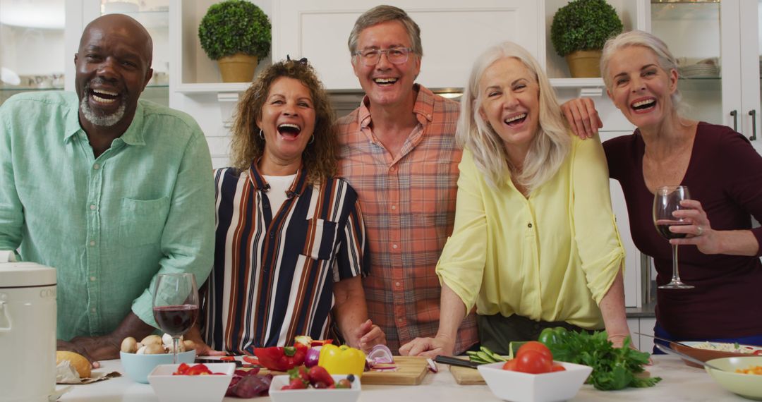 Smiling Senior Friends Enjoy Cooking Together in Modern Kitchen - Free Images, Stock Photos and Pictures on Pikwizard.com