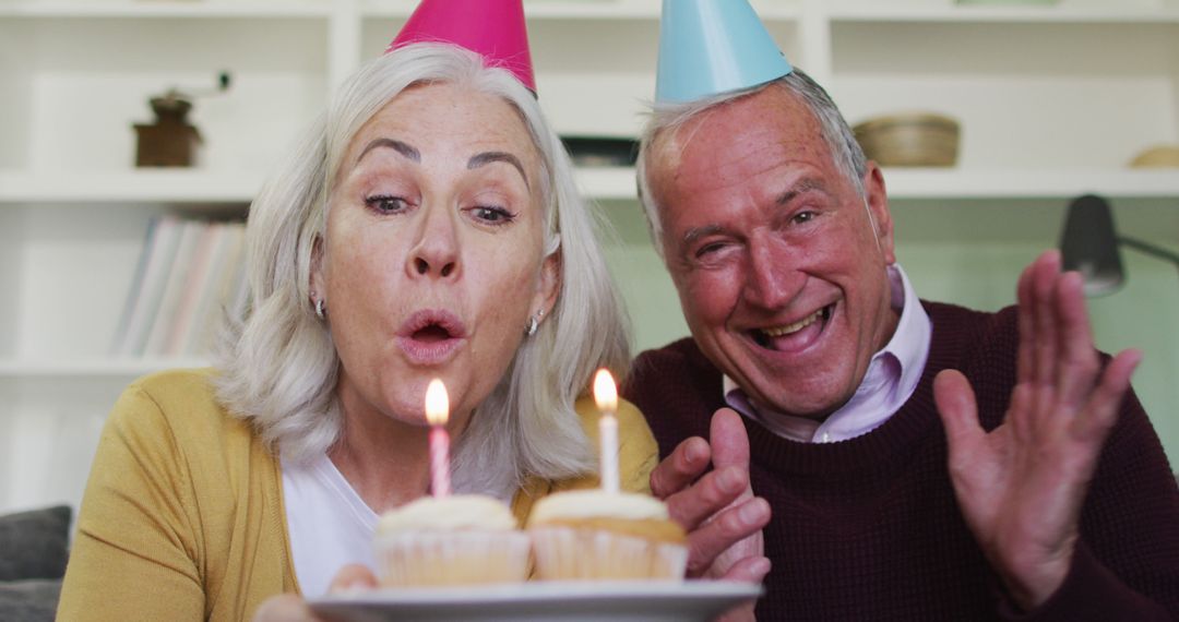 Joyful Senior Couple Celebrating Birthday Together - Free Images, Stock Photos and Pictures on Pikwizard.com