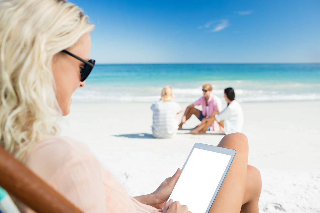 Woman Enjoying Beach Day Relaxing with Tablet with Transparent Screen Outdoors - Download Free Stock Images Pikwizard.com