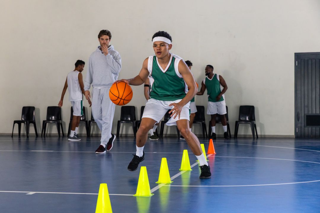 Determined Player Dribbling Basketball Through Training Cone Drills