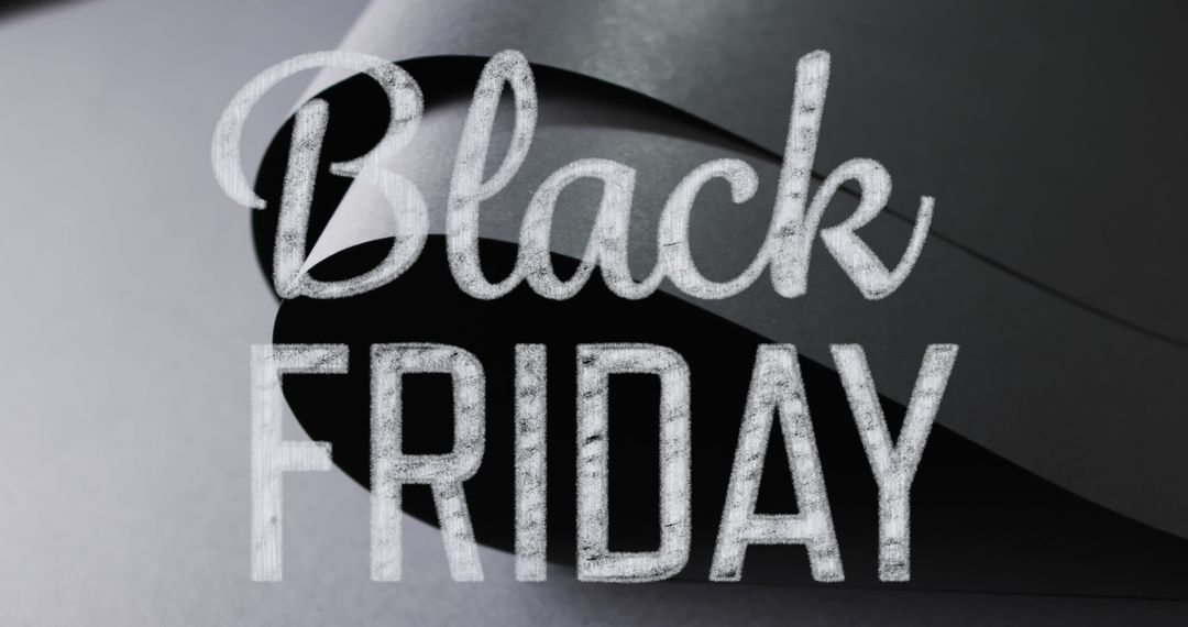 Black Friday Sales Event Concept on Rolled Paper Background
