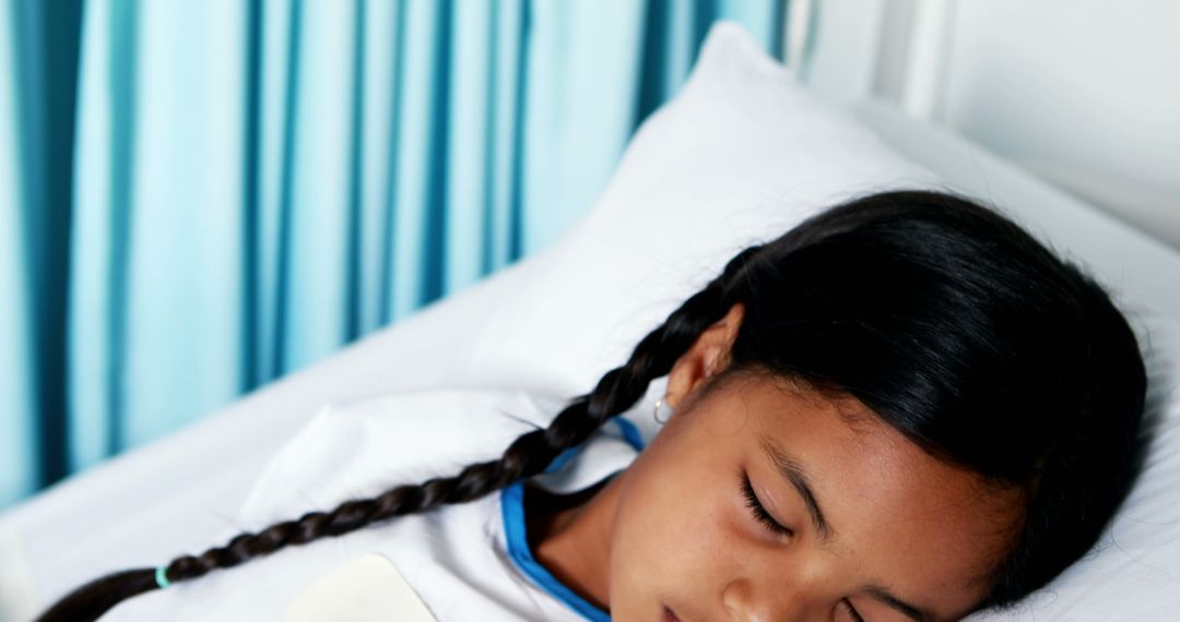 Young Girl Sleeping in Hospital Bed with White Sheets - Free Images, Stock Photos and Pictures on Pikwizard.com