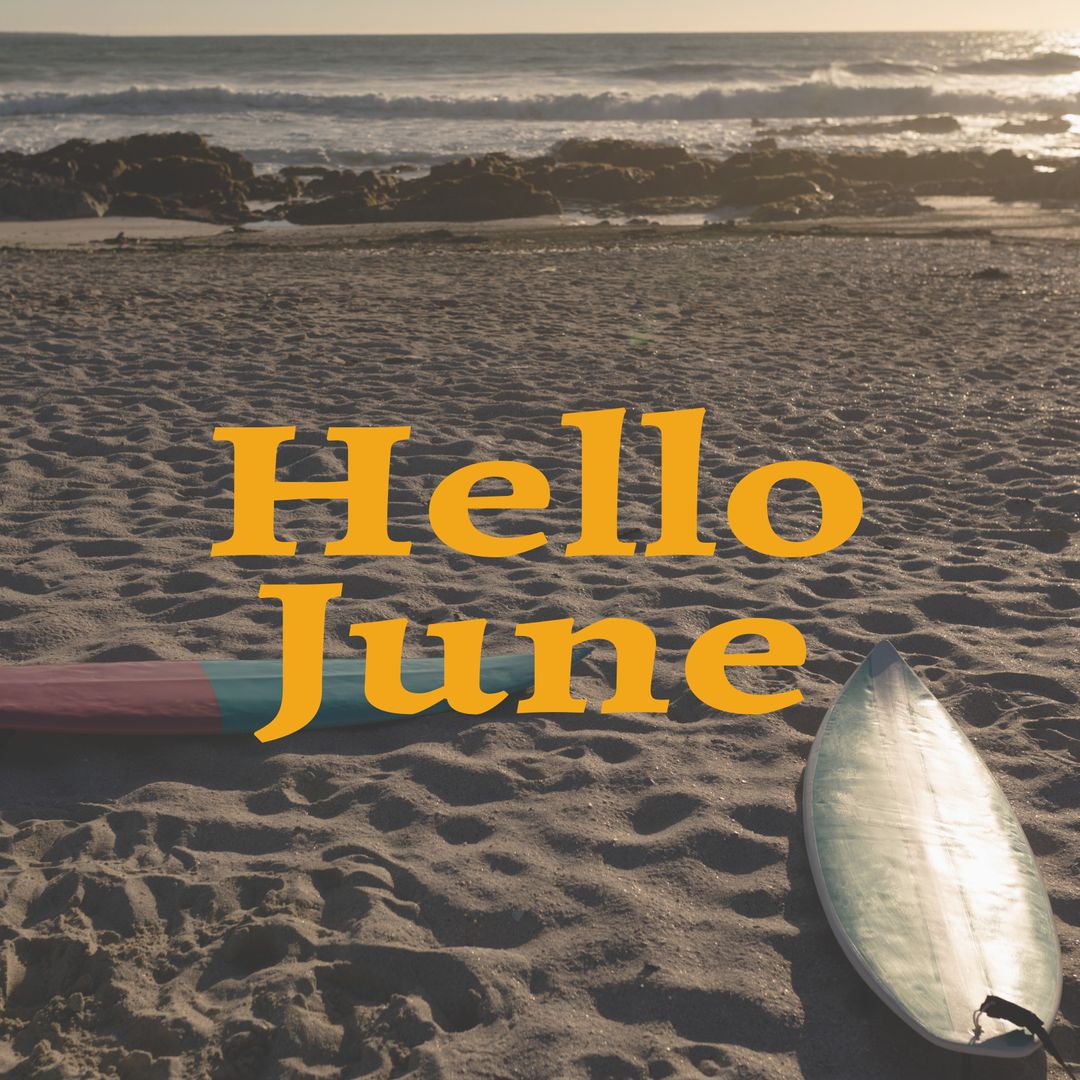 Surfboards on Sandy Beach at Sunset with 'Hello June' Text Overlay