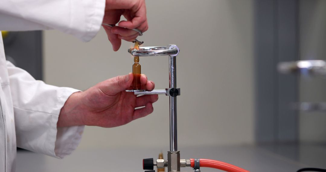 Scientist Conducting Laboratory Experiment with Chemicals - Free Images, Stock Photos and Pictures on Pikwizard.com