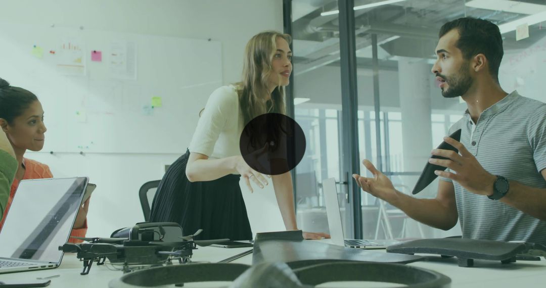 Female Project Lead Directing Team in Modern Office Discussing Drone Design and Innovation