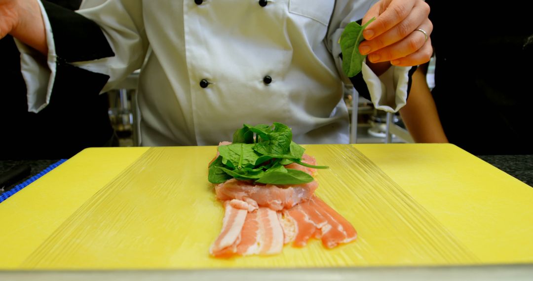 Chef Preparing Chicken with Spinach and Bacon - Free Images, Stock Photos and Pictures on Pikwizard.com