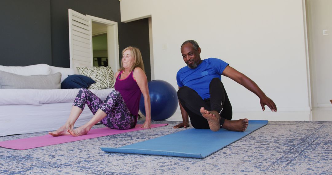 Diverse Senior Couple Engaged in Home Stretching Exercise