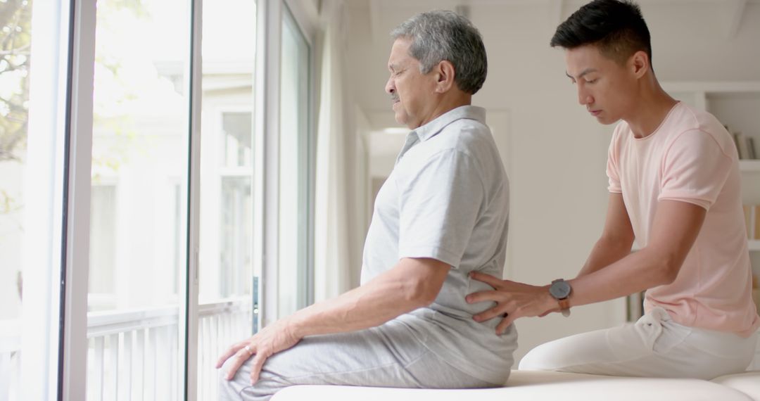 Elderly man receiving physical therapy sessions with assistance from a therapist - Free Images, Stock Photos and Pictures on Pikwizard.com