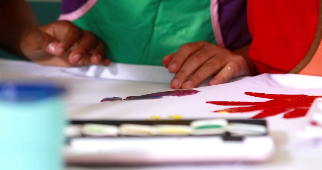 Children Painting With Bright Colors on Paper - Free Images, Stock Photos and Pictures on Pikwizard.com