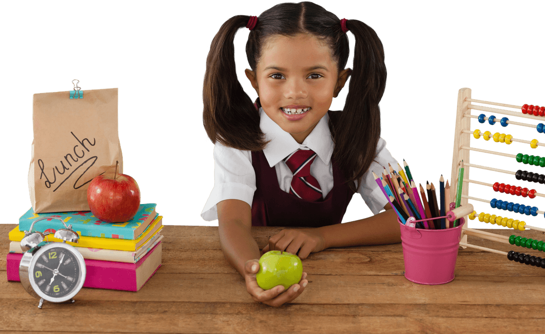 Smiling Schoolgirl Holding Transparent Green Apple at Diverse School Desk