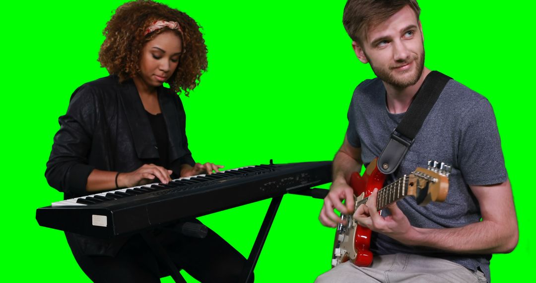 Musicians Playing Keyboard and Electric Guitar in Green Studio - Free Images, Stock Photos and Pictures on Pikwizard.com