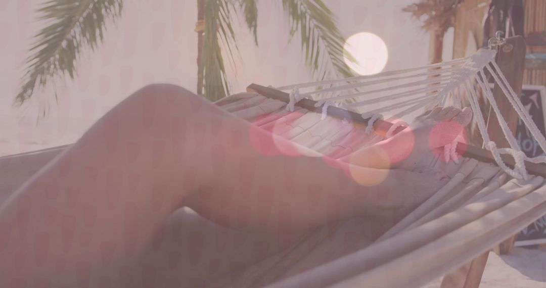 Relaxing in Hammock by Tropical Beach with Palm Trees