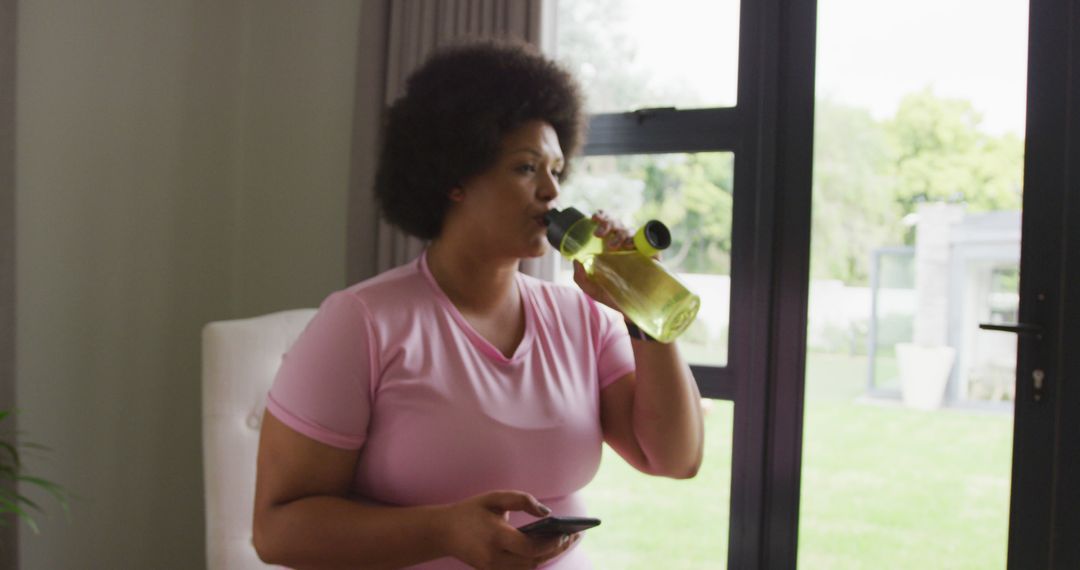 Image of midsection of plus size african american woman in sport clothes preparing for exercising - Free Images, Stock Photos and Pictures on Pikwizard.com