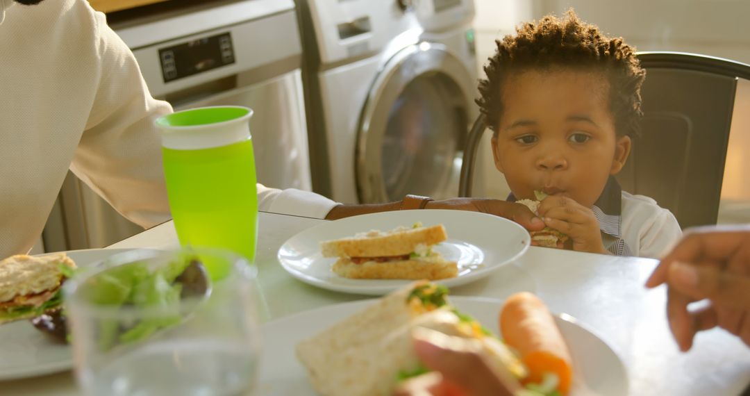 Little Boy Enjoying Healthy Meal in Domestic Kitchen - Free Images, Stock Photos and Pictures on Pikwizard.com