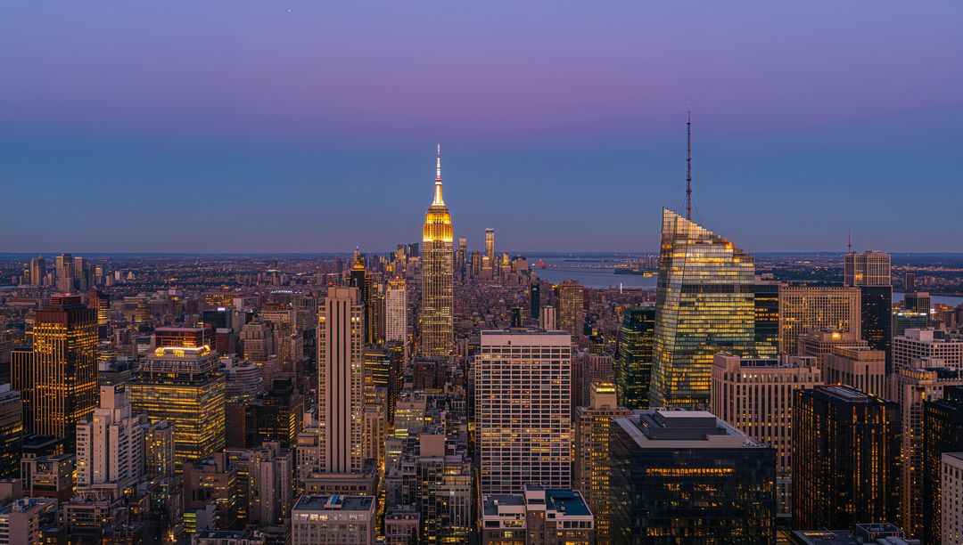 Twilight Manhattan Skyline Featuring Illuminated Empire State Crown and Slanted Glass Tower