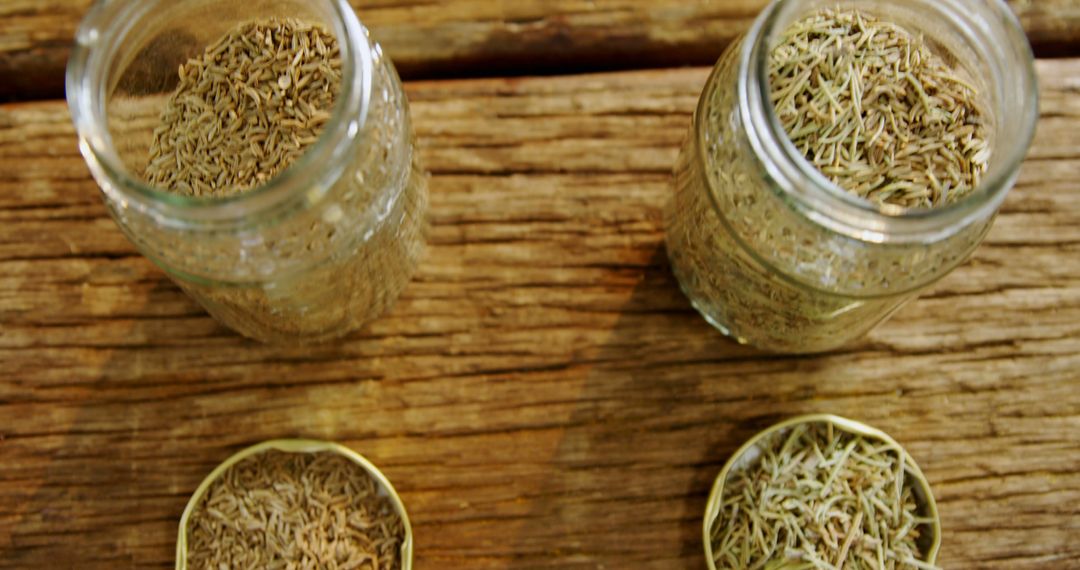 Aromatic Herbs in Glass Jars on Rustic Wooden Table - Free Images, Stock Photos and Pictures on Pikwizard.com