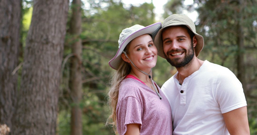 Couple Smiling in Forest During Outdoor Adventure - Free Images, Stock Photos and Pictures on Pikwizard.com