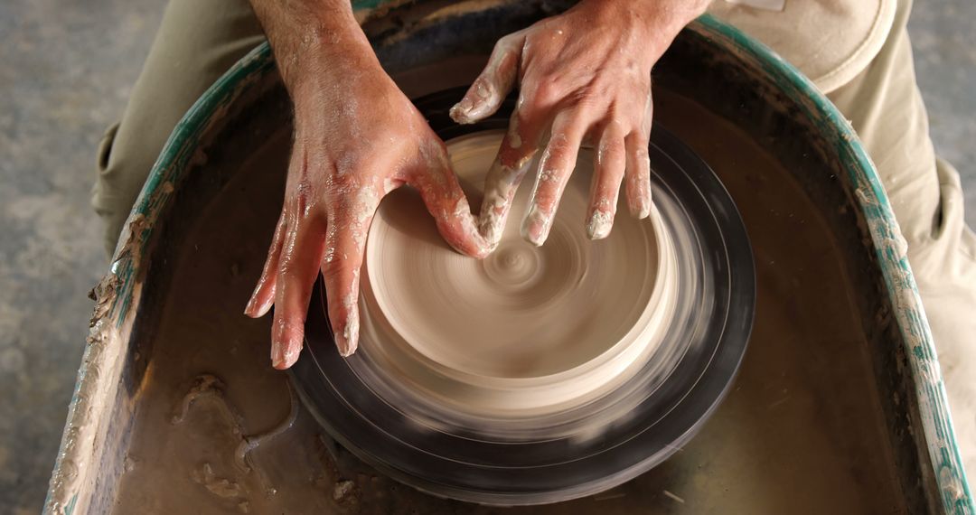 Hands Crafting Clay on Pottery Wheel - Free Images, Stock Photos and Pictures on Pikwizard.com