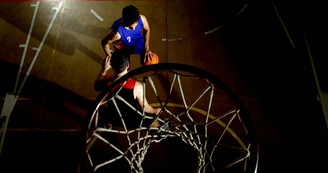 Intense Basketball Game Above View with Scoring Attempt