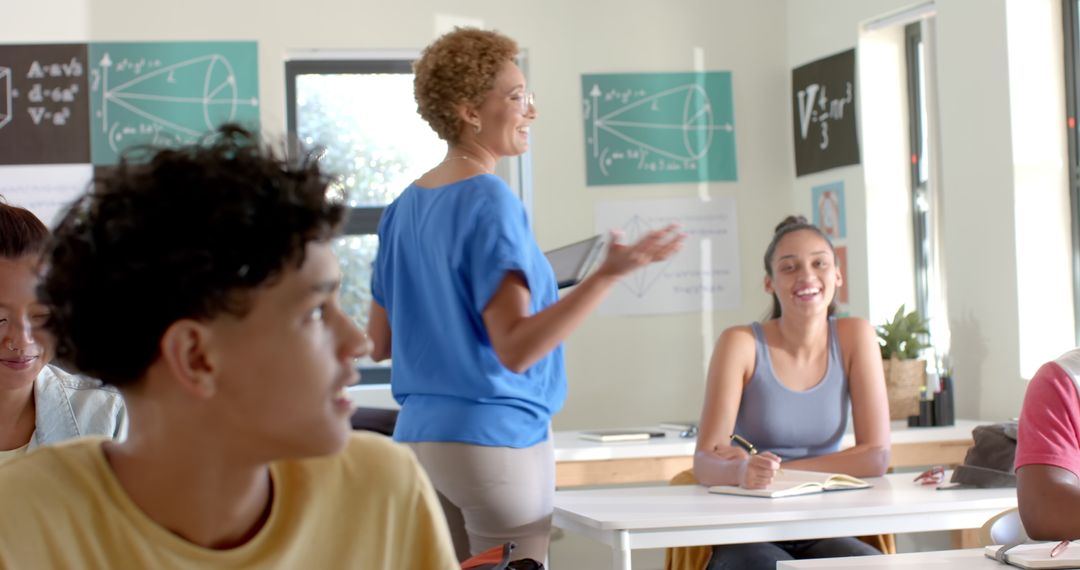 Teacher Instructing Engaged Students in Bright Classroom Environment