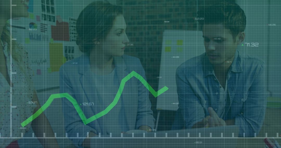 Colleagues Discussing Financial Data with Graph Overlay in Modern Office