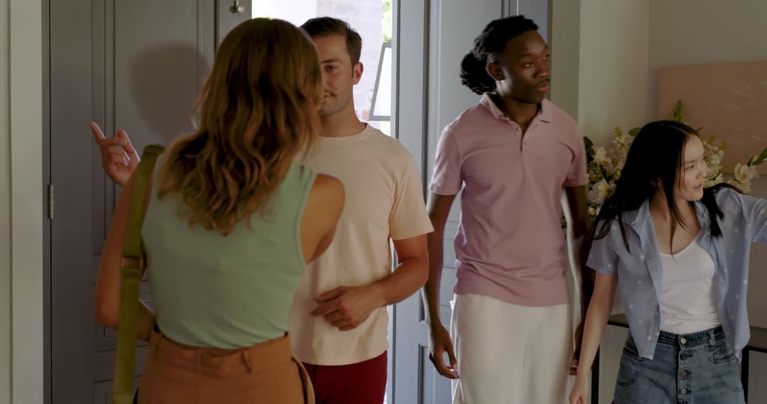 Friends Socializing in Home Entryway Inviting Atmosphere