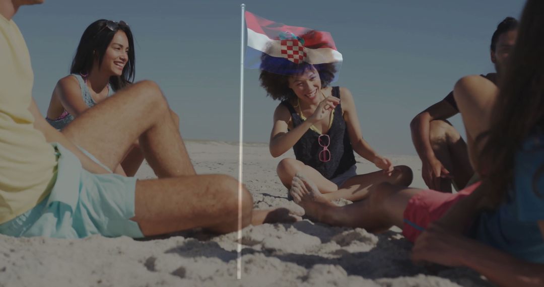Friends Relaxing on Sunny Beach with Croatian Flag