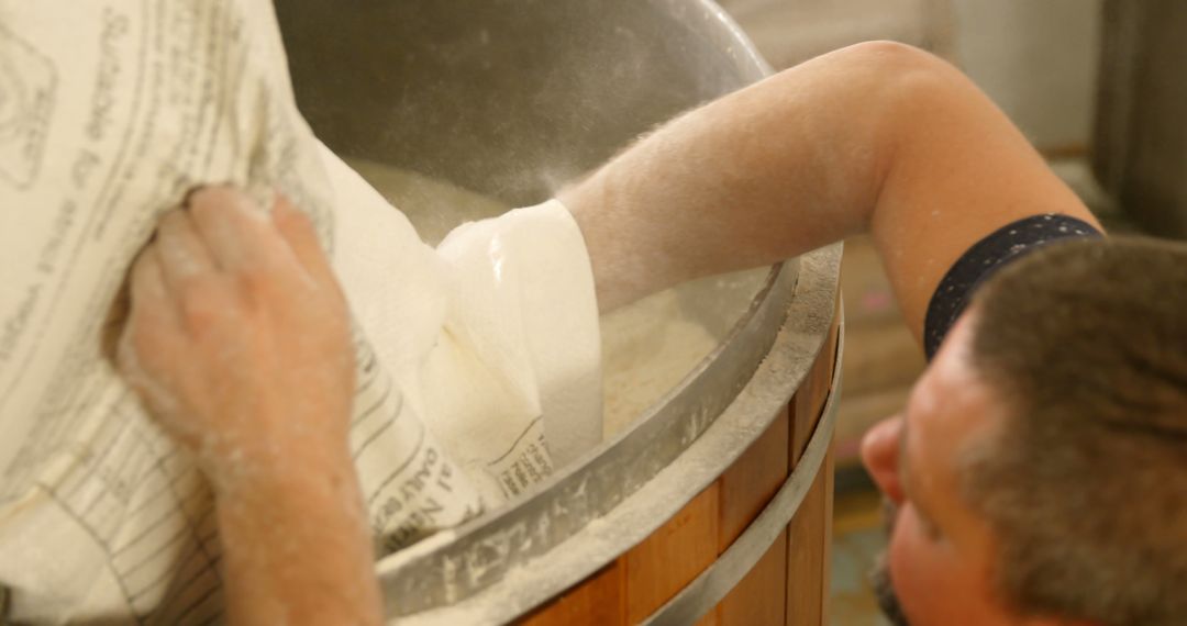 Brewer Pouring Malt into Brewing Vat - Free Images, Stock Photos and Pictures on Pikwizard.com