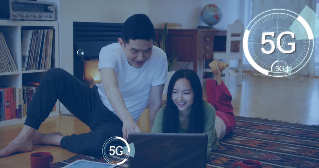 Couple Using Laptop with 5G Technology Overlay at Home