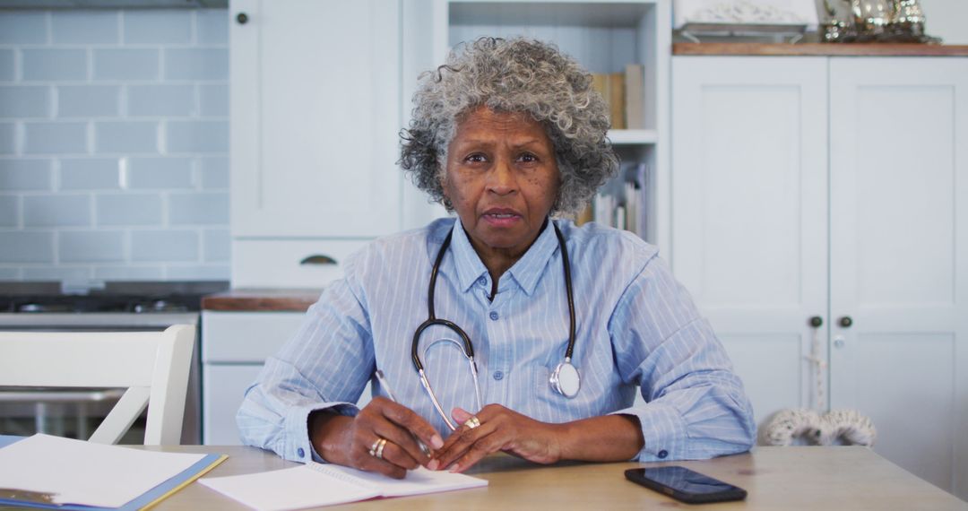 Elderly Female Doctor Discussing Patient Case at Clinic - Free Images, Stock Photos and Pictures on Pikwizard.com