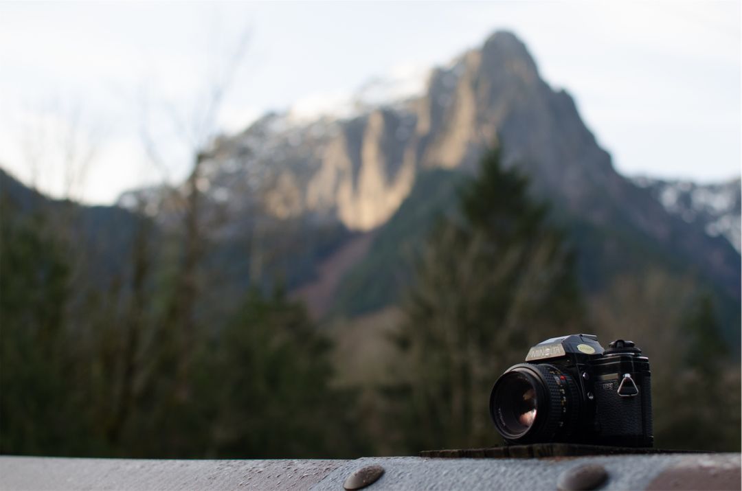 Vintage Camera on Wooden Surface with Mountain in Background - Free Images, Stock Photos and Pictures on Pikwizard.com