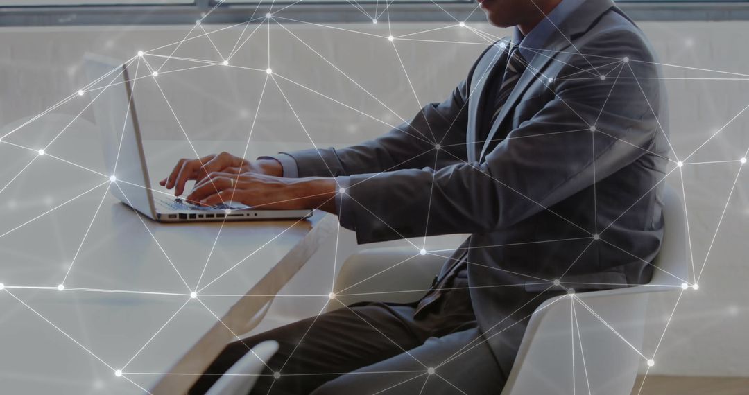 Businessman Analyzing Data on Laptop with Abstract Network Overlay