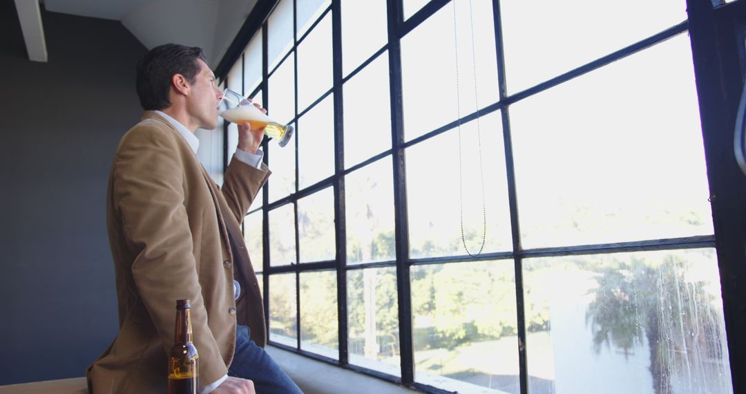 Businessman Enjoying Beer in Modern Office Setting