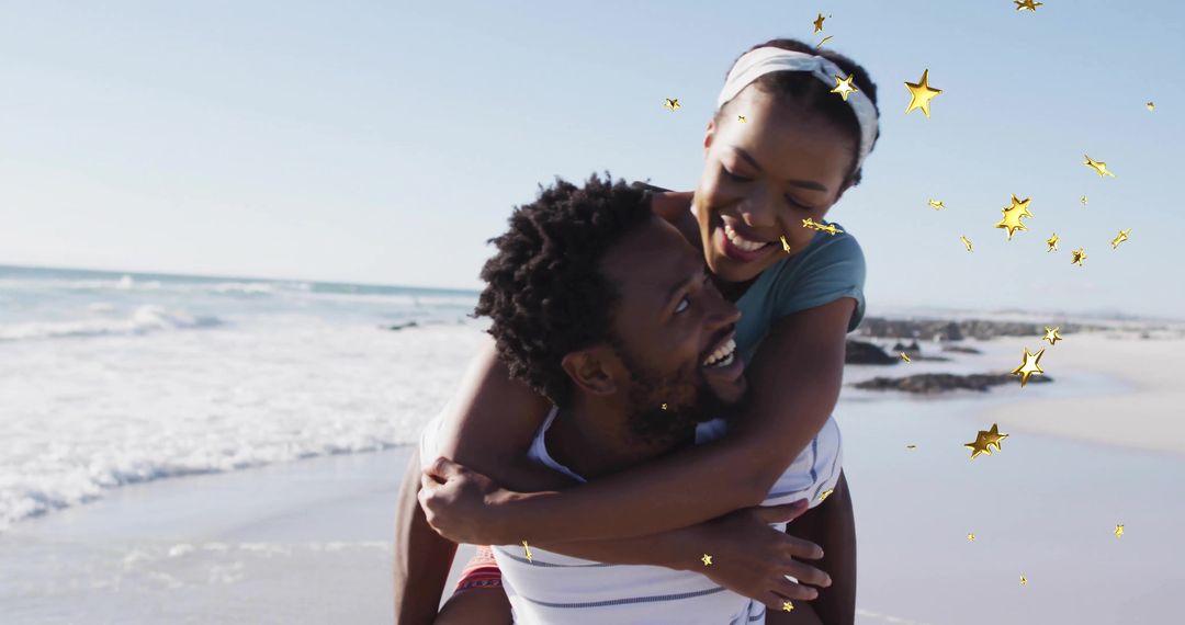 Couple sharing piggyback laugh on sunlit ocean shoreline with golden star overlays