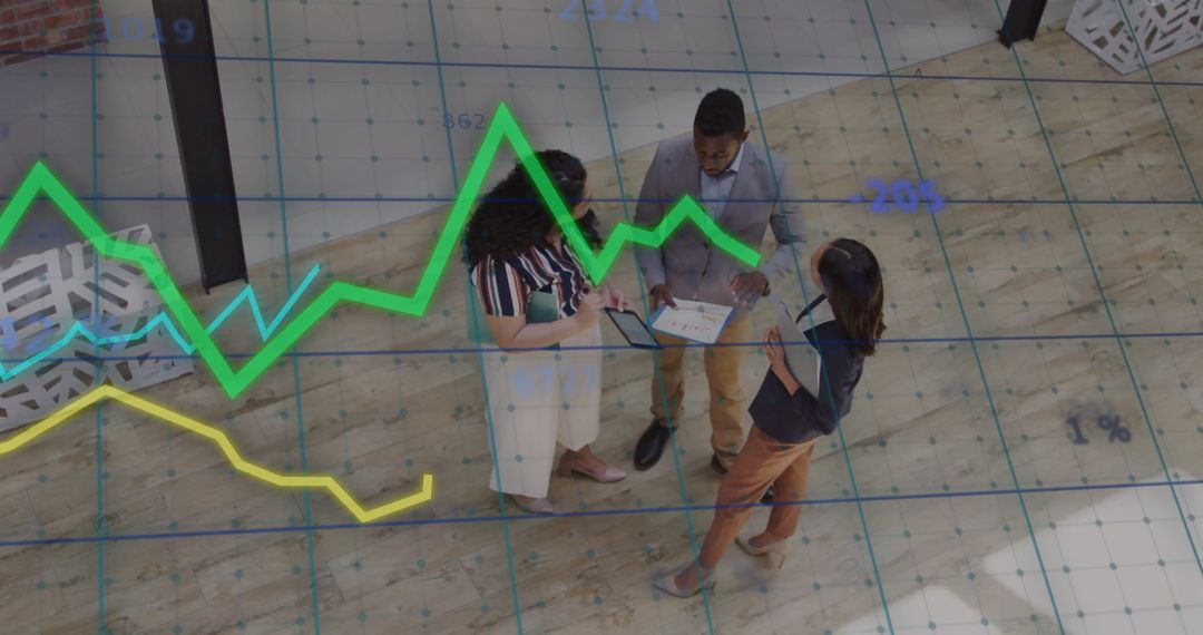 Business Team Analyzing Projected Growth with Graph Overlay
