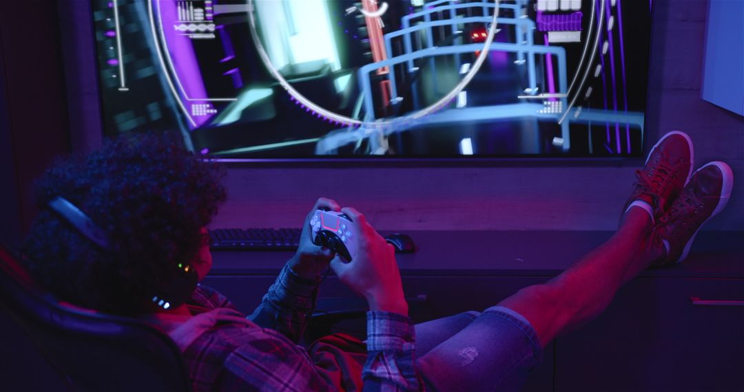 Man Relaxing at Home Gaming with Controller in Neon Glow
