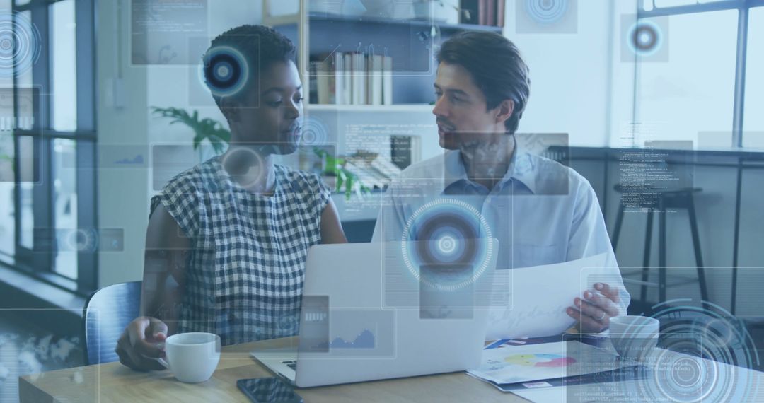 Diverse Team Analyzing Data with Futuristic Interface at Office Desk