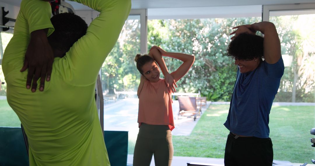 Diverse Group Engaging in Energizing Yoga Session at Home