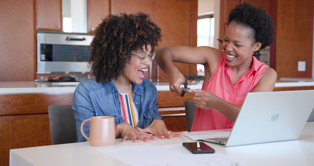 Diverse women colleagues collaborating at home workspace