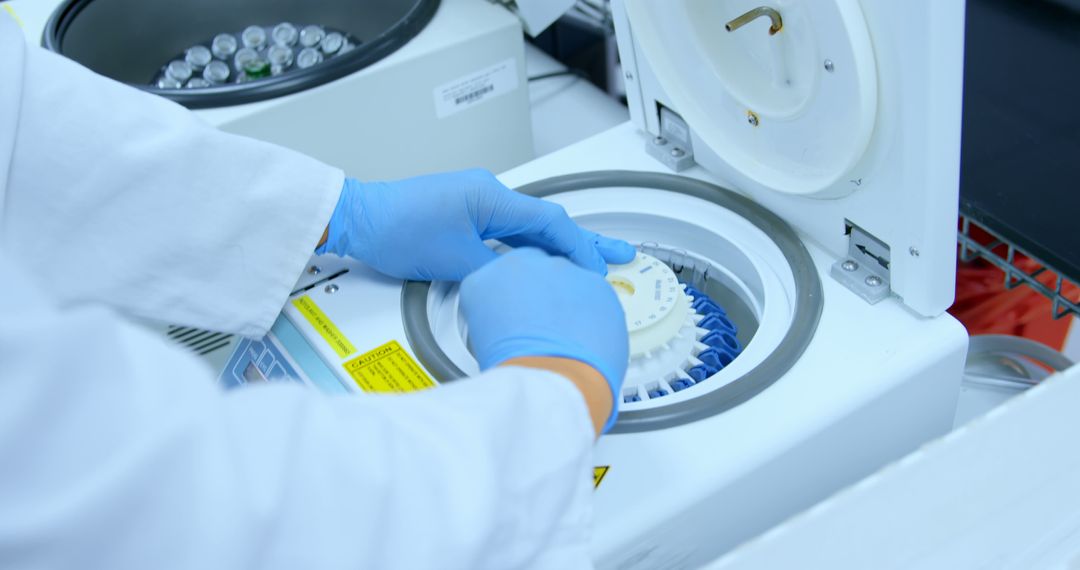 Scientist Using Laboratory Centrifuge in Research Lab - Free Images, Stock Photos and Pictures on Pikwizard.com