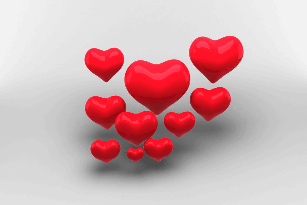 Glossy Red Hearts Floating on Transparent Background