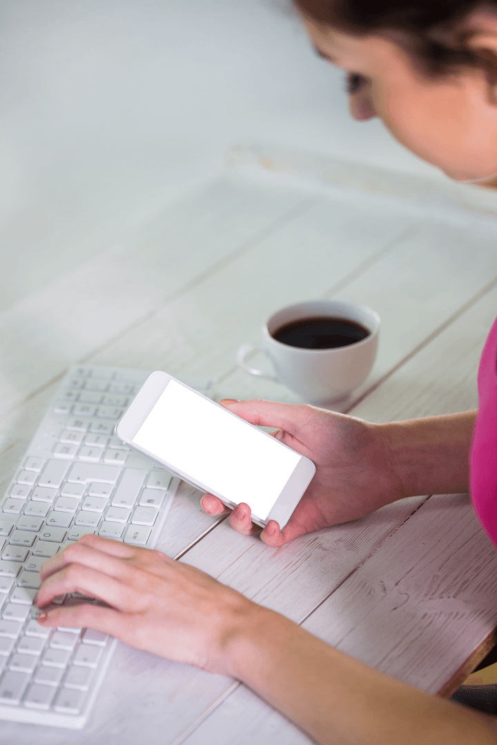 Transparent Display: Woman Multitasking with Phone and Keyboard